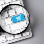 Online shopping & business icon on retro computer keyboard